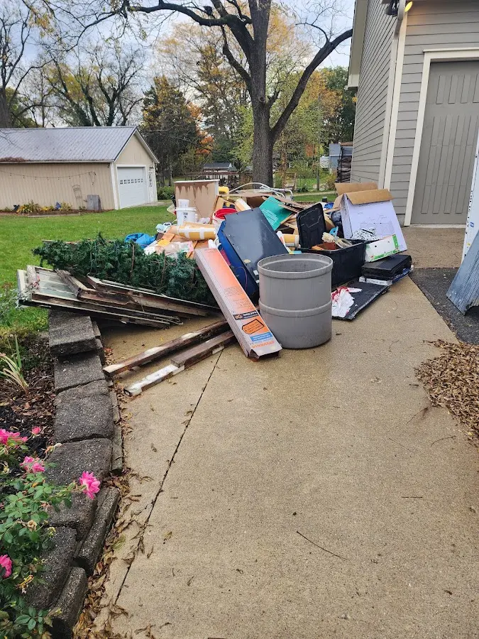 Dumpster being loaded with debris for Residential Dumpster Rental in Willard